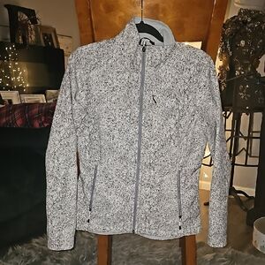 The North Face Womens sz Medium jacket. Very nice and Unique style. Gray&White!